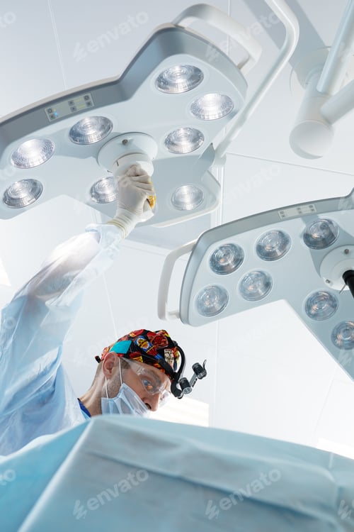 Preview: Surgeon Adjusting Operating Room Lights in Hospital