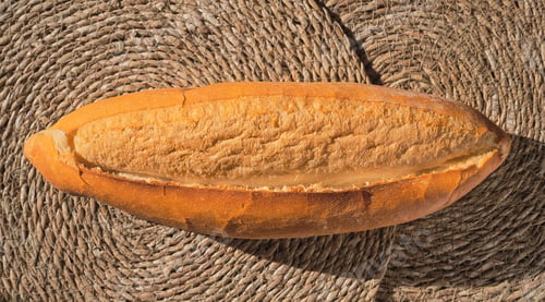 Preview: Turkish freshly baked bread (ekmek) lined. Top view of bread