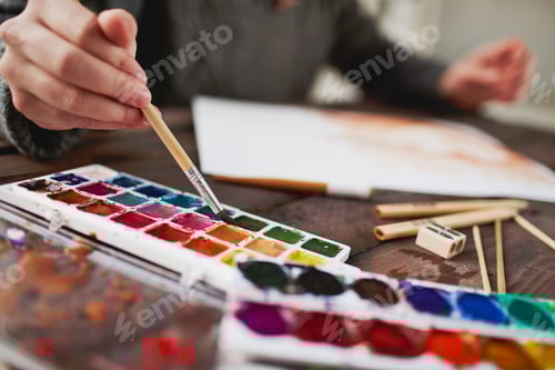 Preview: Watercolor Painting with Bright Colors on Wooden Table
