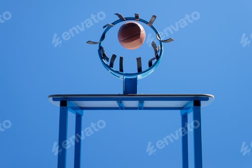 Preview: Low angle view of scoring a ball into a basketball hoop against blue sky