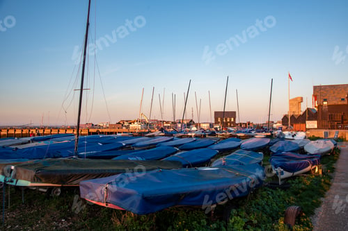 Preview: Sailboats covered in marina at sunset. Whitstable fishing harbor