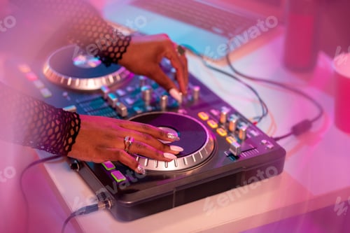 Preview: Hands of African female deejay moving turntable and mixing sounds