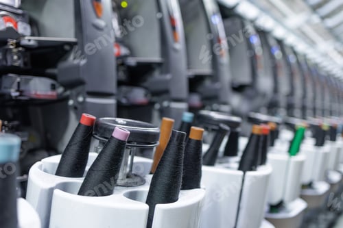 Preview: Industrial spinning machines with yarn cones in textile factory line