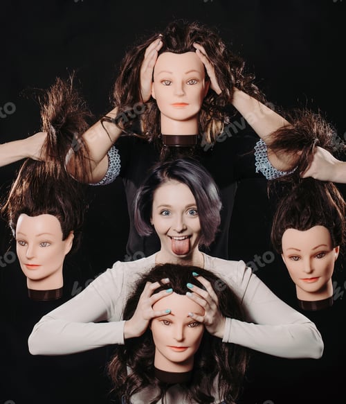Preview: Concept Of How Difficult It Is To Be A Woman. Charming Brunette Girl Surrounded By Mannequin Heads