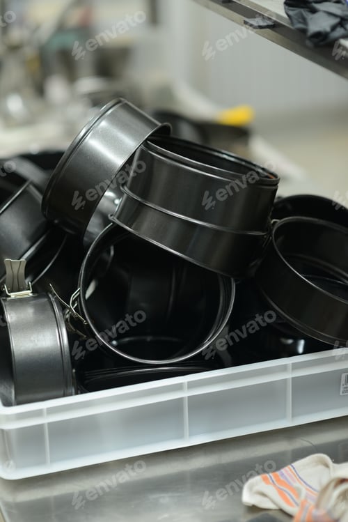Preview: bunch of washed cake pans in professional kitchen
