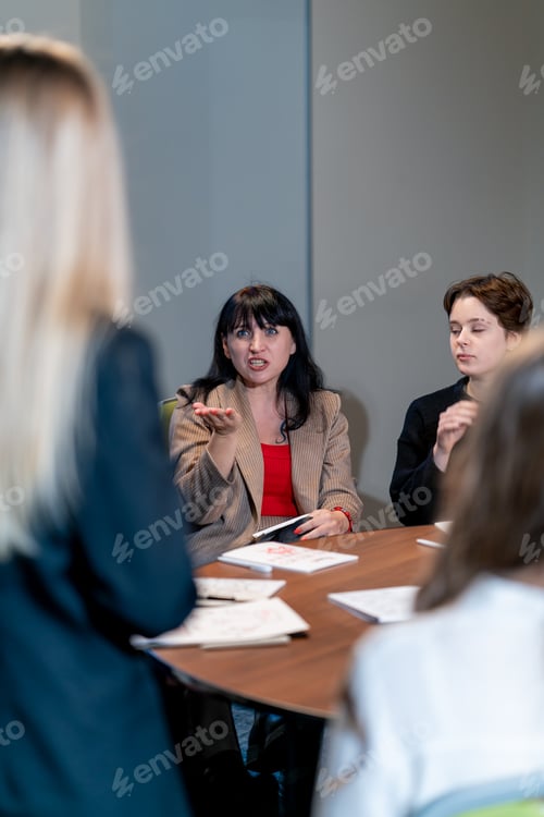 Preview: business meeting the audience asks a question or offers to speaker during a brainstorming session