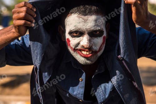Preview: Close-up portrait of a horrible scary zombie man. Horror. Halloween.