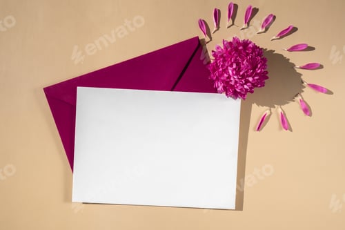 Preview: Composition with empty paper note and envelope beautiful spring pink flowers on beige background