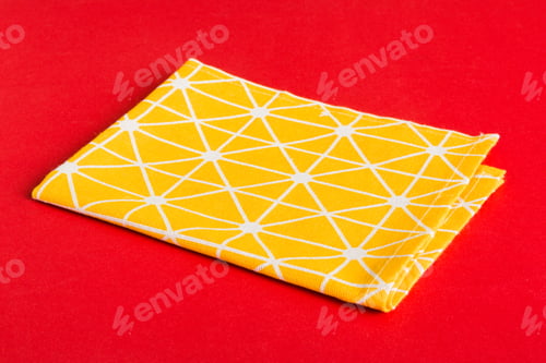 Preview: top view with yellow empty kitchen napkin isolated on table background