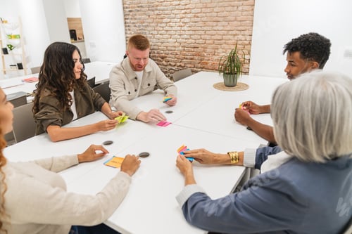 Preview: Diverse business team brainstorming ideas in modern coworking space