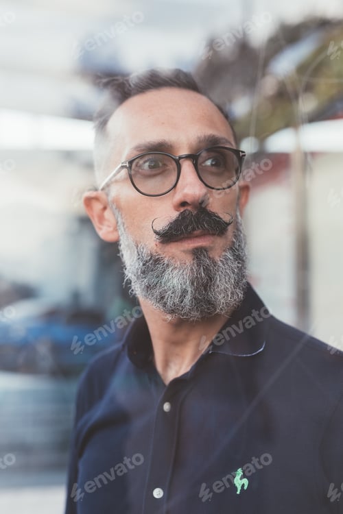 Preview: portrait mid adult bearded man grizzled smiling