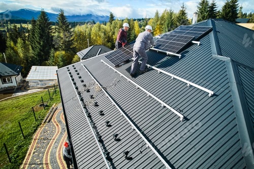 Preview: Technicians carrying photovoltaic solar module while installing solar panel system on roof of house