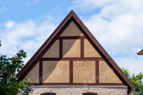 Preview: Closeup of a roof of a building against the blue sky on a sunny day