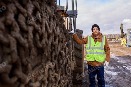 Preview: Bearded Worker Posing with Heavy Truck