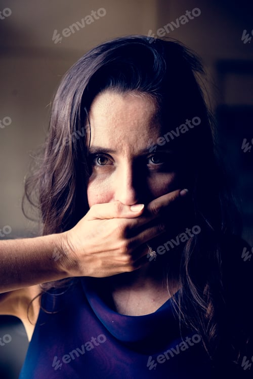 Preview: Woman with hand covered over her mouth