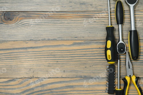 Preview: Different tools on a wooden background.