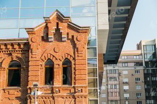 Preview: Architecture contrast old house and a new modern building