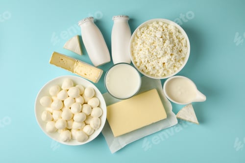 Preview: Different fresh dairy products on blue background, top view