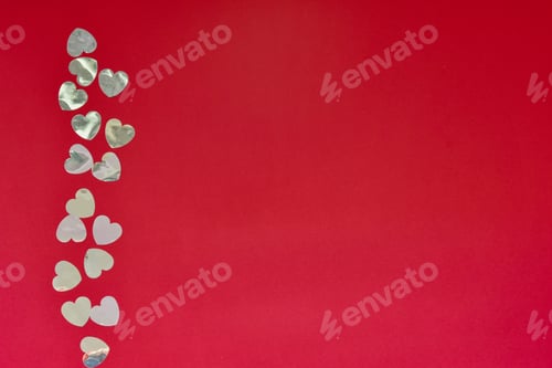 Preview: Hearts of paper on red textured background. San Valentine day concept.
