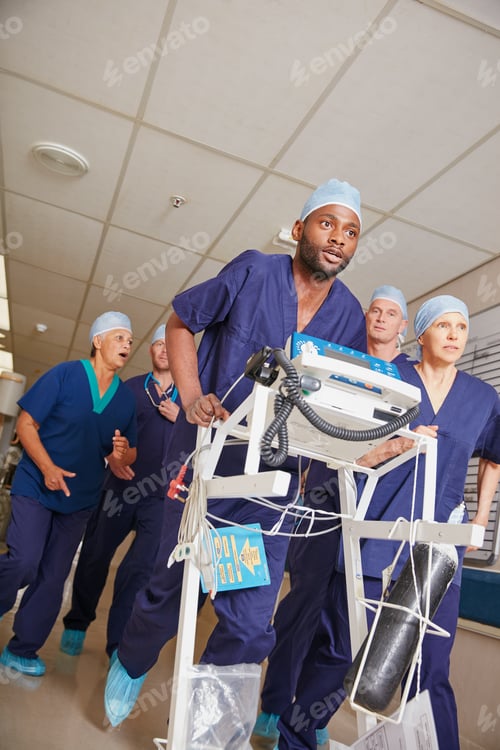 Preview: Its go time. Shot of a medical team rushing through a hospital corridor.