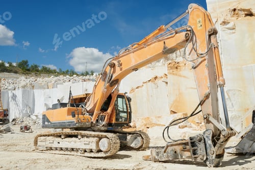 Preview: Hydraulic excavator with grabber standing on territory of marble quarry