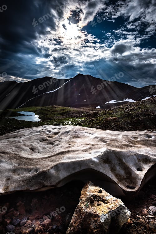 Preview: Sun Shines on a chunk of snow Colorado Mountains