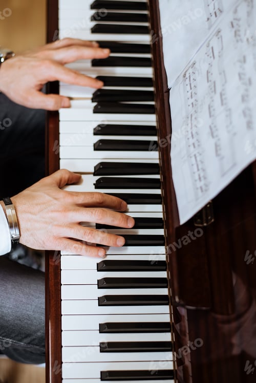 Preview: Crop male hands playing piano