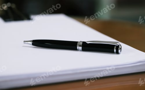 Preview: Black pen on pile of blank documents paper closeup blur background