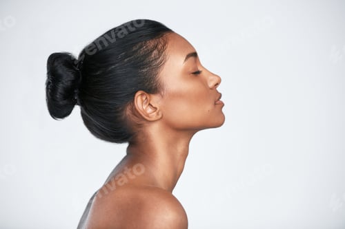 Preview: The glow comes from within. Shot of a beautiful young woman posing against a white background.