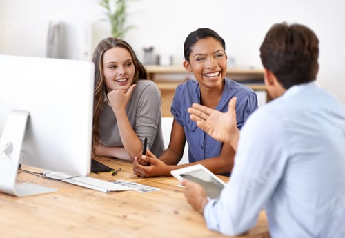Preview: They come up with great ideas. A group of designers discussing something in their office.
