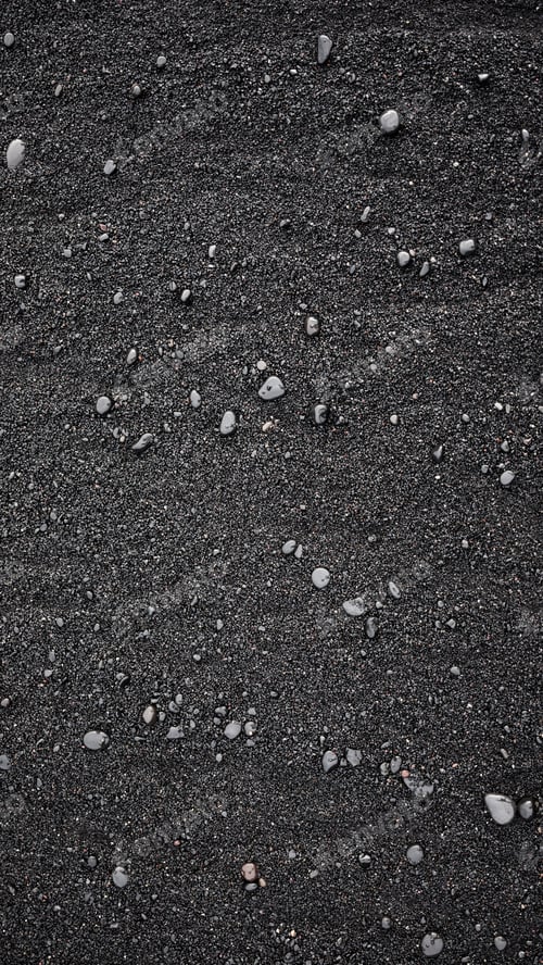 Preview: Black sand as a background in the Iceland sea shore. Abstract composition.