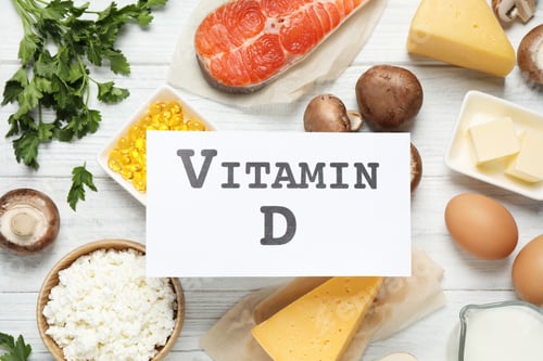 Preview: Flat lay composition with products rich in vitamin D on white wooden table