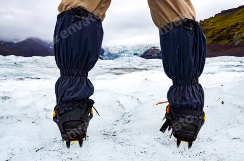 Preview: Mountaineer's feet with crampons on the frozen glacier, Vatnajokull