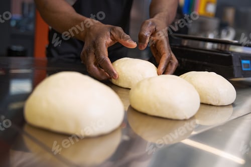 Preview: African chef preparing food for baking at the kitchen