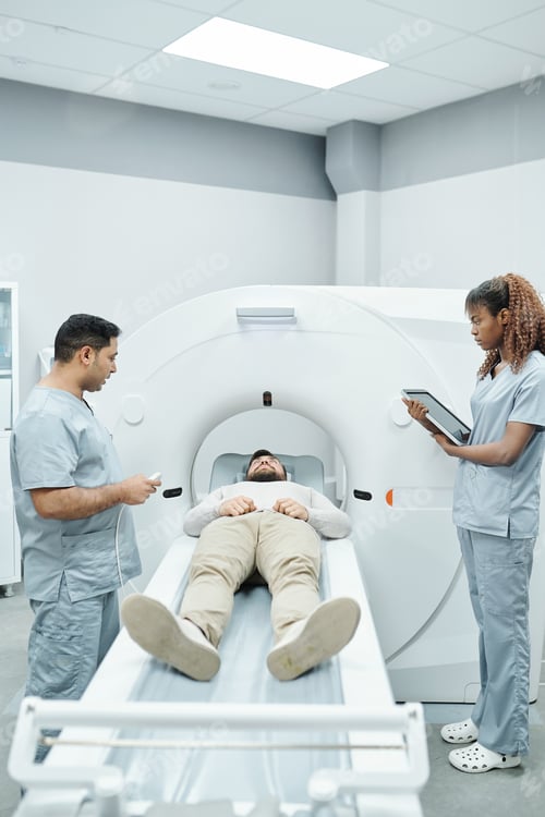 Preview: Young assistant in uniform and doctor standing on both sides of long couchette