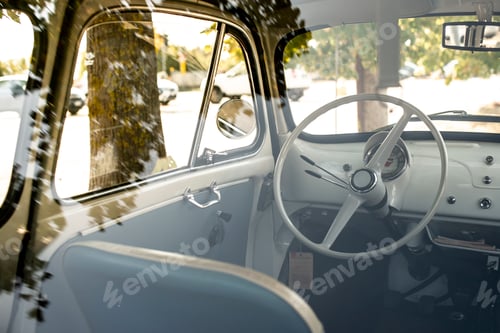 Preview: Interior of small white vintage car on the street. No people. Wh