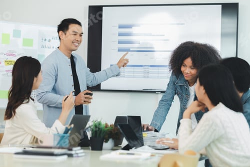 Preview: A group of startup management people are having a brainstorming meeting in the conference room, with