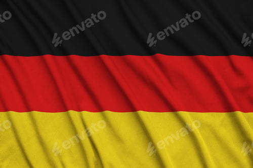 Preview: Germany flag is depicted on a sports cloth fabric with many folds. Sport team waving banner
