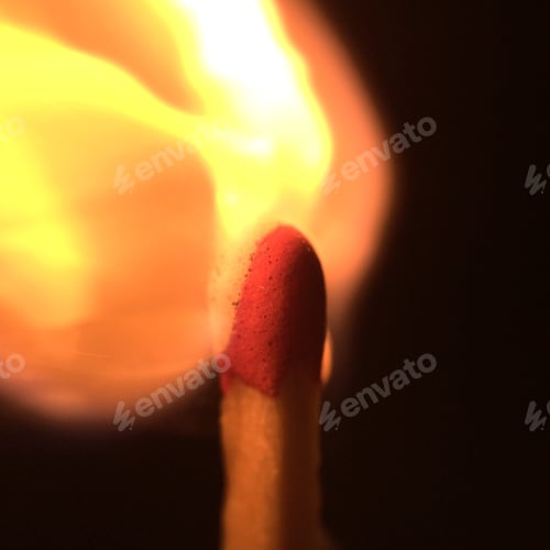 Preview: Close up shot of a match stick flushing on a black background