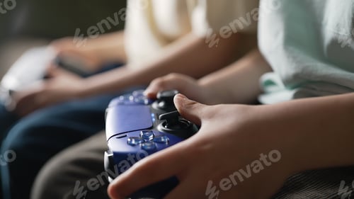 Preview: Young Boys Presses Buttons, Using Joypad Controller, Wireless Gamepad. Hobby.