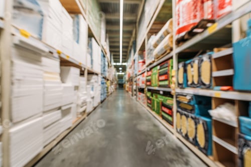 Preview: blurred view of shelves with boxes and styrofoam in warehouse