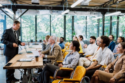 Preview: Cinematic image of a conference meeting.
