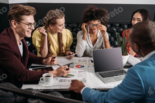 Preview: group of business colleagues working together in cafe