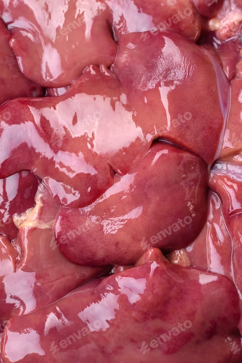 Preview: Fresh raw chicken or turkey liver in a ceramic plate with salt, spices and herbs