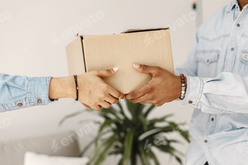 Preview: Couple with boxes moving into new home smiling
