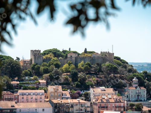Preview: Beautiful shot of the cityscape of Lisbon with trees in Portugal