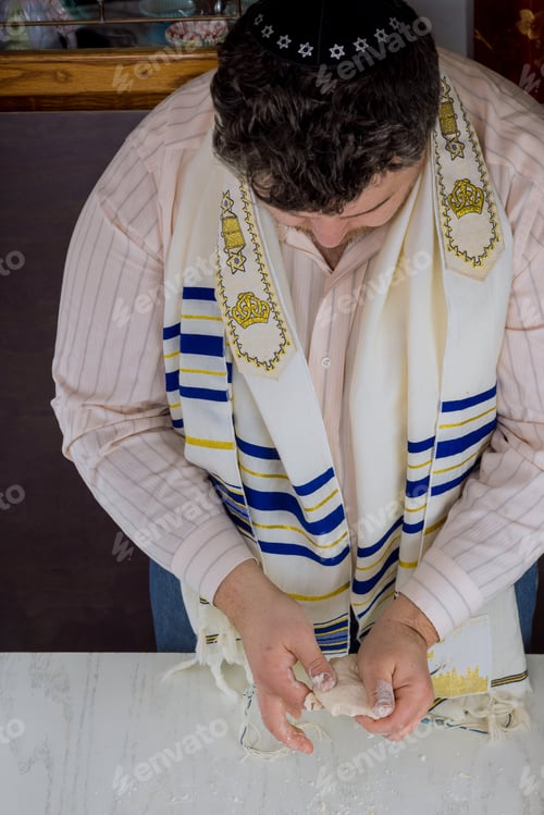 Preview: Hand made flat kosher matzah in the orthodox Jewish man prepare for baking with Jewish festival