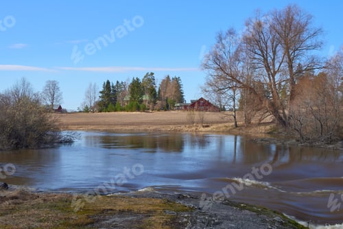 Preview: River flood in spring in April in Finland in Europe.