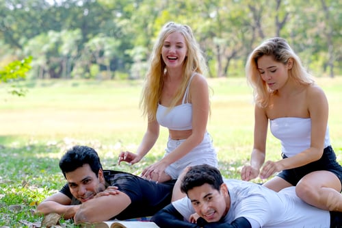 Preview: Two lovely teens massage to sport men in the garden with fun emotion.