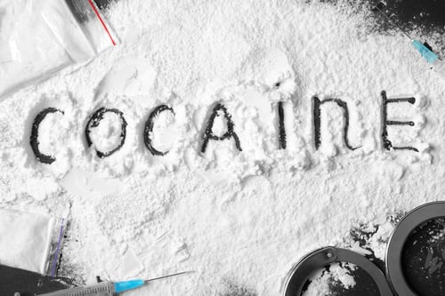 Preview: Composition with cocaine powder on black background, top view